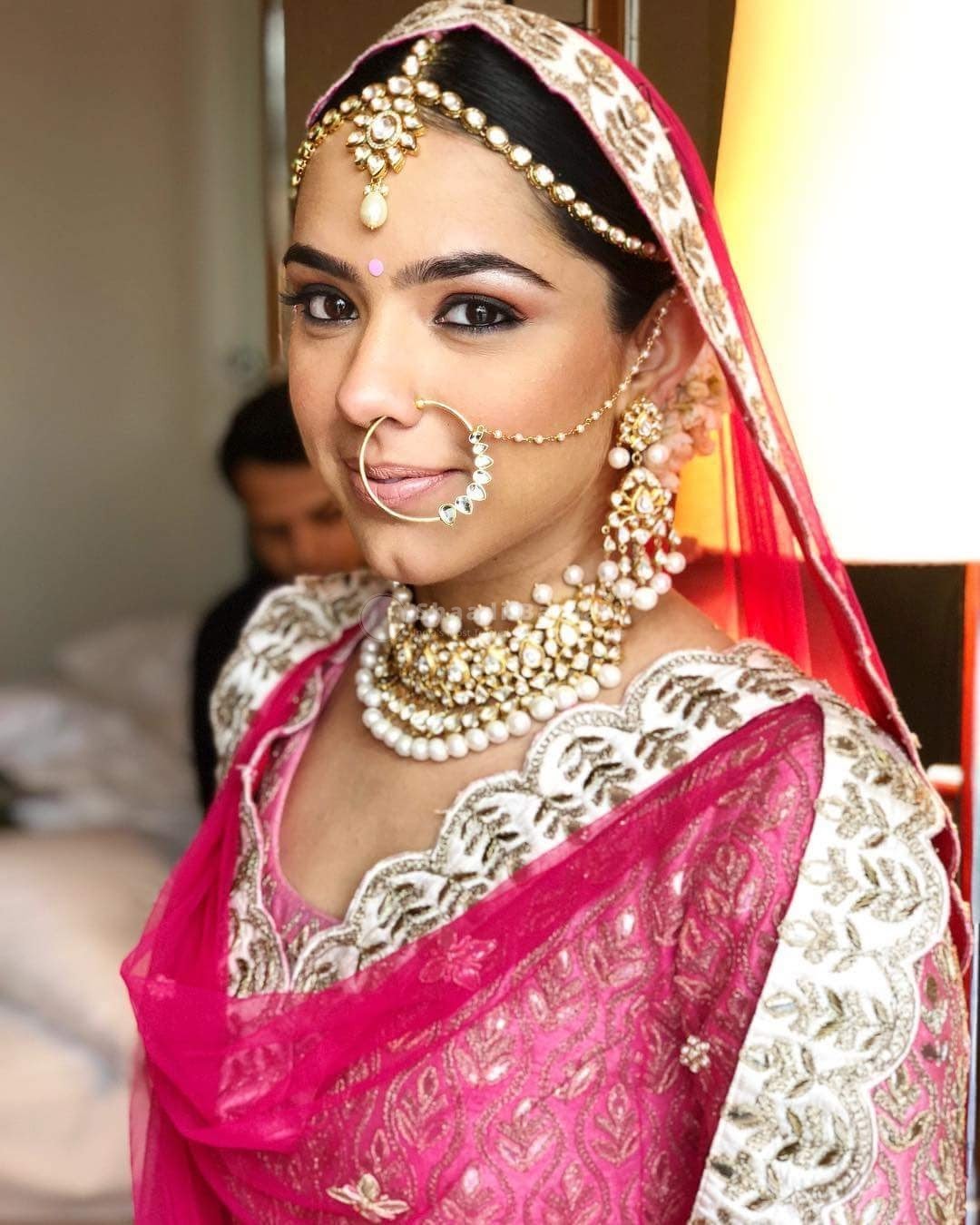 Photo of A bride in a light pink lehenga with gold and green jewellery | Lehenga  jewellery ideas, Bridal jewellery inspiration, Pink lehenga